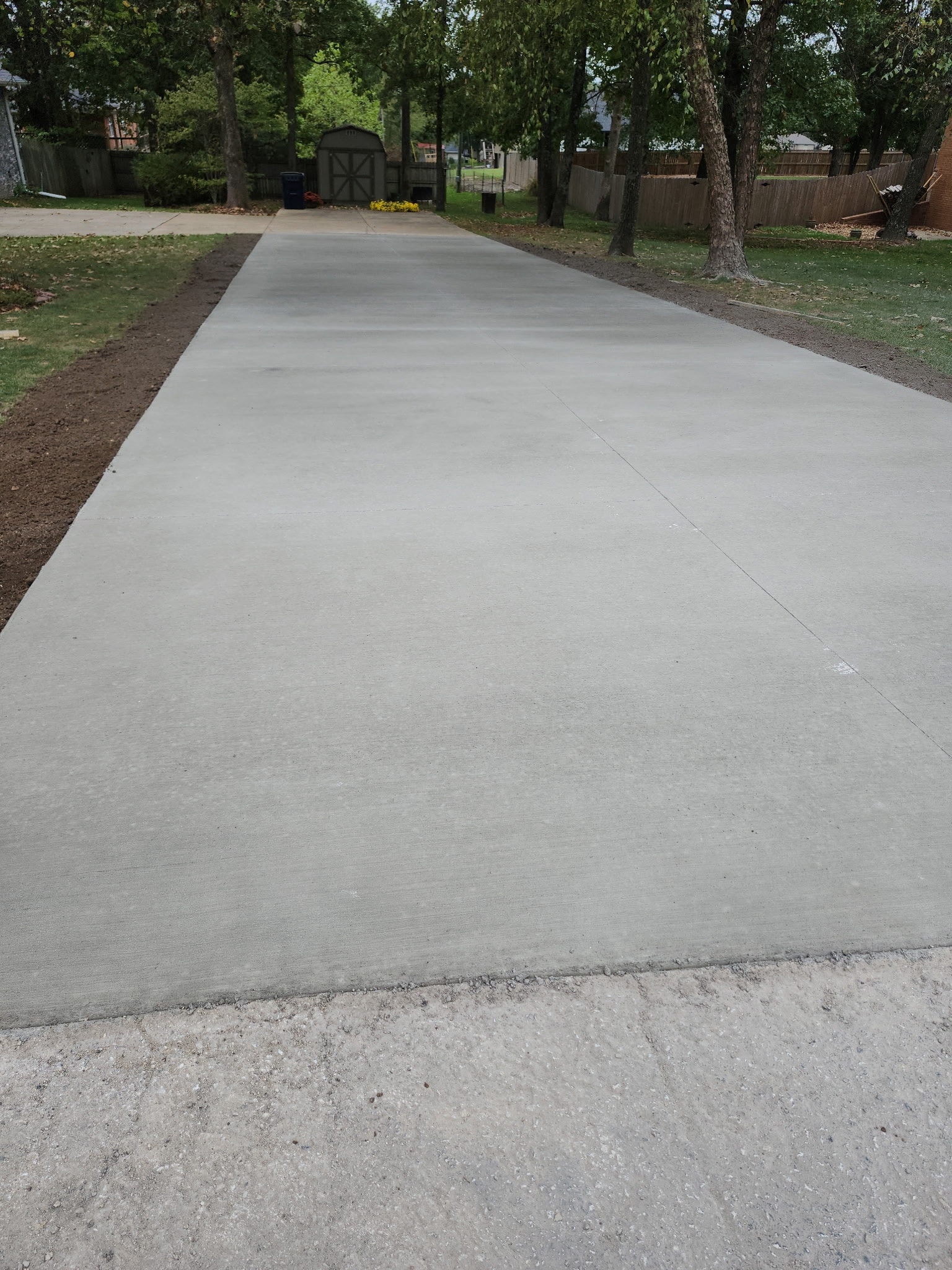Trailer park pad preparation Marshfield MO - gravel base and concrete runners installation